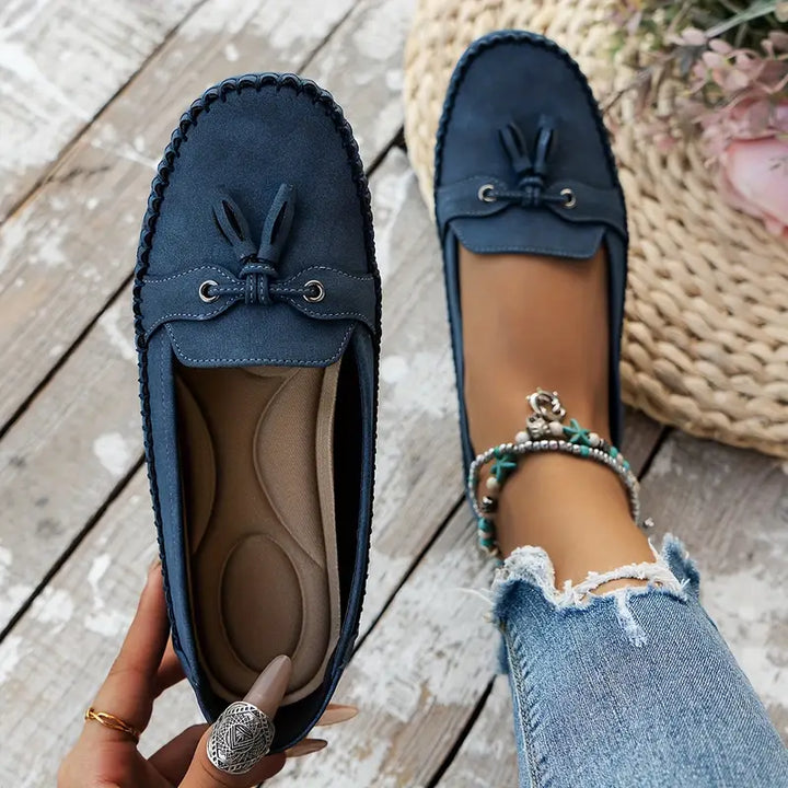 "Women's classic bow loafers in soft suede, stylish flat slip-ons with elegant bow accent, ideal for any occasion."