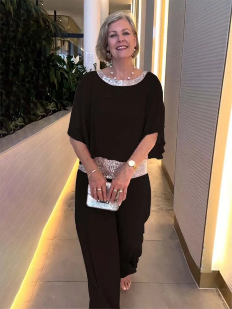 "Women's elegant chiffon set with sequin accents, featuring batwing-sleeve blouse and versatile wide-leg trousers."